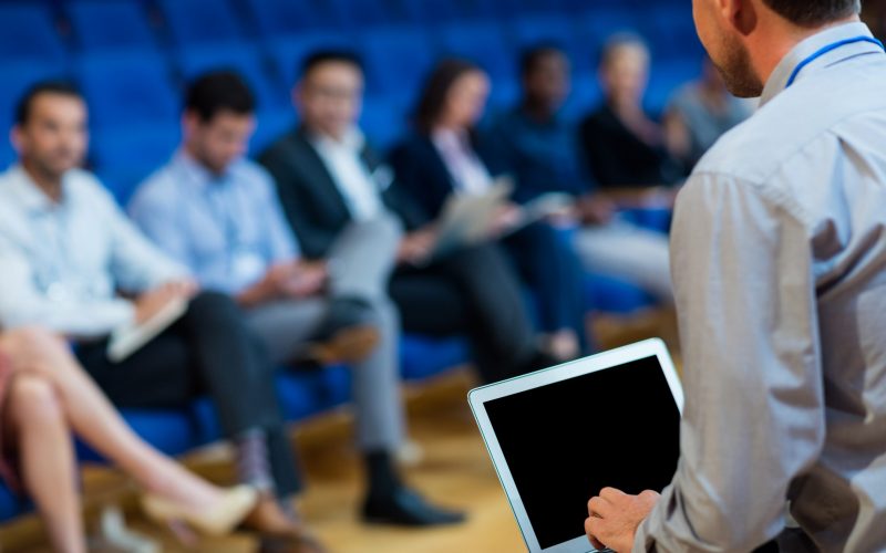 Business executives participating in a business meeting at conference center